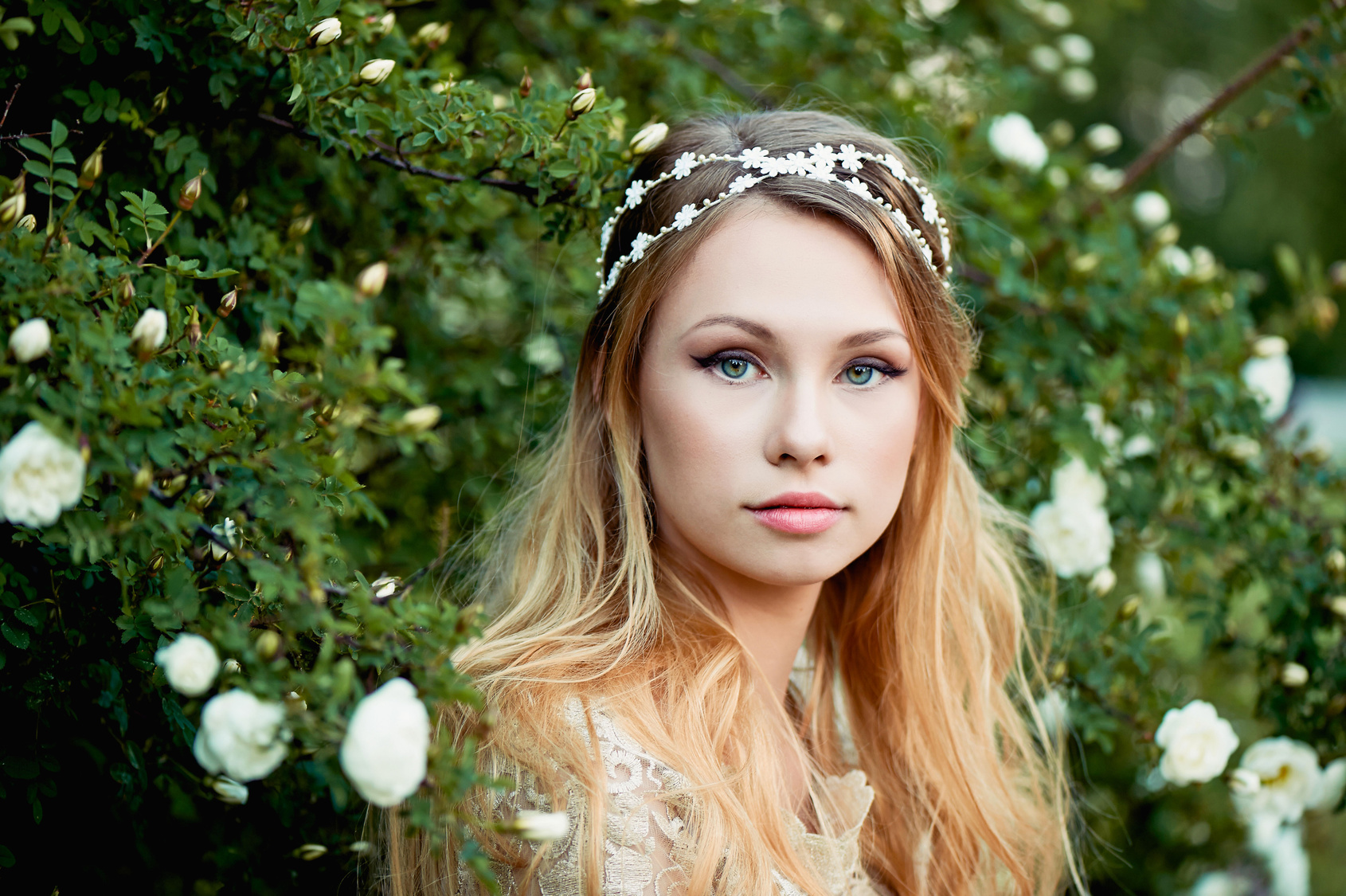 Close-up portrait of beautiful young girl with long blonde hair. Gentle and bright
